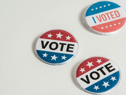 Several election themes pins and stickers