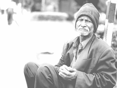 Homeless man stares into the distance