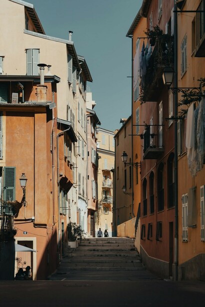 The charming streets of Vieux Nice, France, with its distinctive brown concrete buildings, offering a glimpse into the rich history and beauty of this iconic destination on the French Riviera