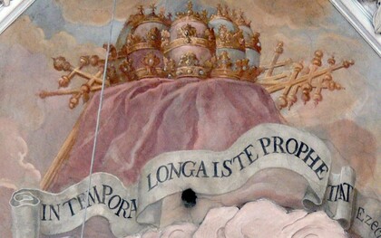 Emblema de San Malaquías con una cita del libro de Ezequiel: “IN TEMPORA LONGA ISTE PROPHETA” [Este profeta para la eternidad]. Metten (Baja Baviera). Iglesia de la abadía: fresco (1722/24) de Wolfgang Andreas Heindl