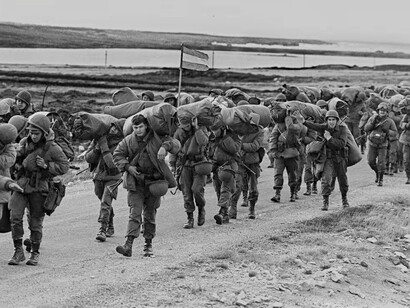Argentine soldiers on their way to occupy the captured Royal Marines base in Port Stanley, 13 April 1982