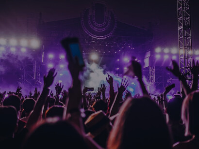 A photo capturing individuals making the iconic rock hand sign