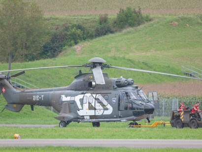 Swiss Air Force Aerospatiale AS332 military utility helicopter being towed at Payerne Airport