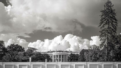 Image of The White House with clouds suggests that a fall of the established order is imminent 