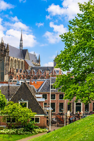 Scenic view of the historic Hooglandse Kerk and the surrounding traditional buildings along the canals of Leiden, Netherlands
