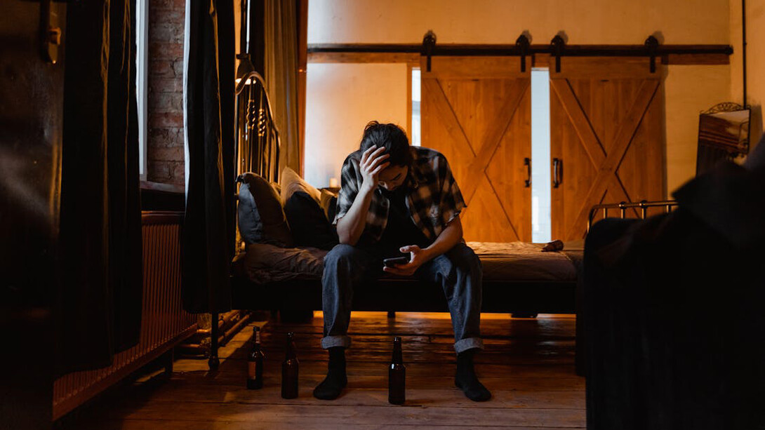 Amid the mess of beer bottles and digital distractions, the struggle to balance self-worth with social media's relentless standards becomes painfully clear