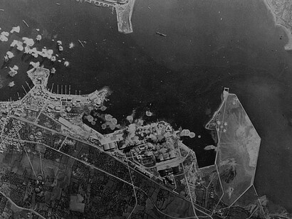 Bizerte, Tunisia, bursts of bombs from a flying fortress exploding at the Bizerte naval base held by the Axis