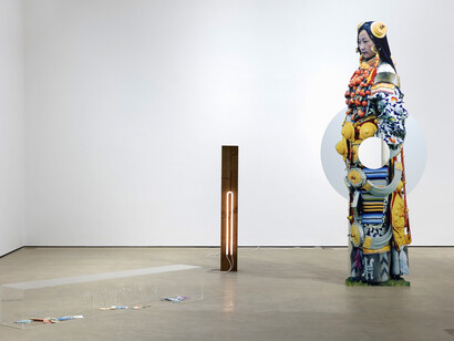 Lothar Hempel, Living Sign, 2018, archival inkjet on dibond, powder-coated steel, Perspex box, foreign currency, wood neon. 3 components: figure: 278 x 113 x 49 cm, 109 1/2 x 44 1/2 x 19 1/4 ins; Perspex box: 200 x 30 x 30 cm, 78 3/4 x 11 3/4 x 11 3/4 ins; neon: 150 x 20 x 10 cm, 59 1/8 x 7 7/8 x 4 ins. Photo: Robert Glowacki. © Lothar Hempel. Courtesy the artist & Stuart Shave/Modern Art, London