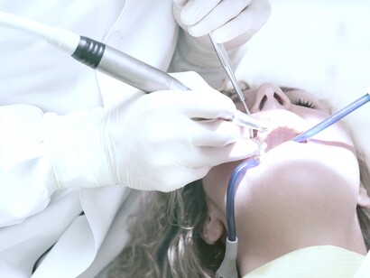A patient during dental treatment. Dental scaling is a common treatment for gum disease patients