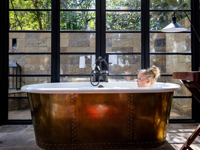 A woman relaxing taking a bath. Self-love helps you to deal with many difficult emotions, such as anger or anxiety