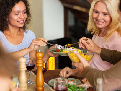 Volunteers gather to enjoy a delightful dinner featuring delicious food