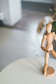 A marionete being displayed to represent how theatre influences our way of living