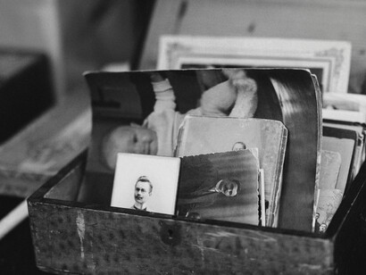 A box of vintage photos of people and children