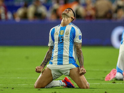 Argentina centre back Cristian Romero celebrates the championship