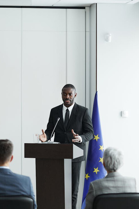 Lively debates flourish amongst members of a European Union conference, the intricacies of the power dynamics being unveiled