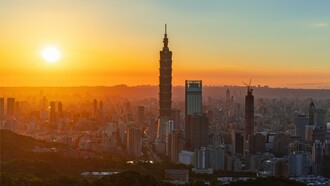 A panoramic view of a modern city at sunrise, showing the promise and challenges of an increasingly connected future