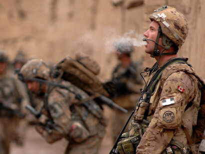 U.S. and coalition forces mentoring the Afghan National Army during a dismounted patrol