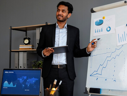 A sports manager analyzing data and planning ahead for economic boost