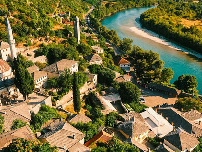 The Osum River flowing through the valley beside Berat’s traditional neighborhoods, reflecting the natural setting of Berat, Albania