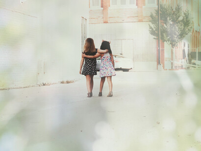 Two people sharing a moment of friendship and kindness in a world that needs it