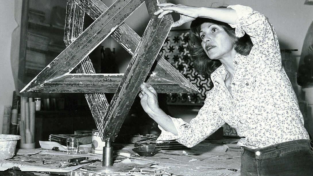 Monir Shahroudy Farmanfarmaian in her studio working on Heptagon Star, Tehran, 1975. Photo: Courtesy of the artist and The Third Line, Dubai