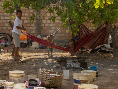 Outside the official camp, Indigenous refugees set up their hammocks in a empty lot in Boa Vista