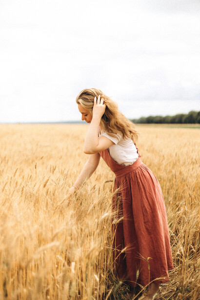 A solitary woman in a sunlit wheat field, symbolizing renewal, self-discovery, and the beauty of inner transformation