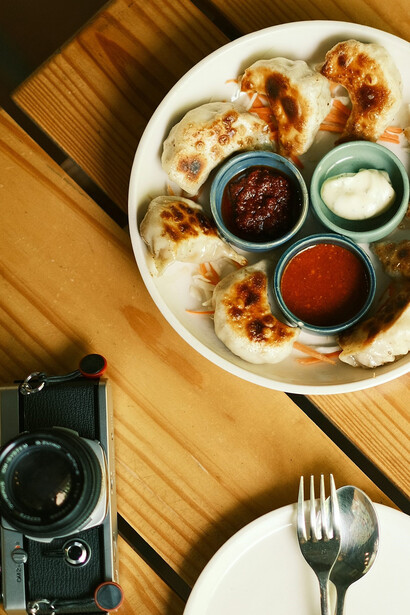 Momos beautifully displayed on a table, showcasing a popular Nepali dish