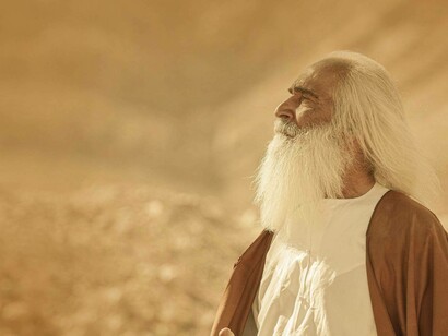 A man reflective and asking for help from an all-powerful source, God