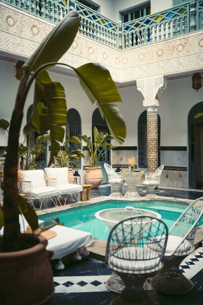 White and blue swimming pool inside a traditional riad in Marrakesh, Marrakesh–Safi, Morocco