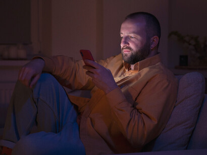 Despite the glow of the screen, the room feels more empty than ever, as though the world outside has been reduced to fleeting interactions and shallow gestures