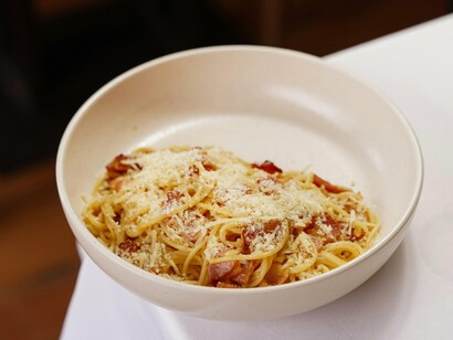 Carbonara, a Roman classic, defines comfort food with pasta, cheese, and pancetta