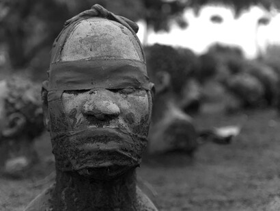 A silenced and covered face, symbolizing how enslaved people were denied voice, identity, and recognition of their humanity