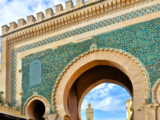 The vibrant blue entrance of Bab Bou Jeloud, symbolising Fez’s enduring artistic and architectural legacy