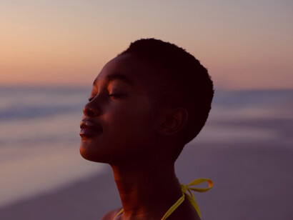 As the sun rises, she grounds herself in the moment, embracing the calm as a powerful foundation for a motivated day