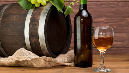 Wooden barrel oak with bottle and glass of wine