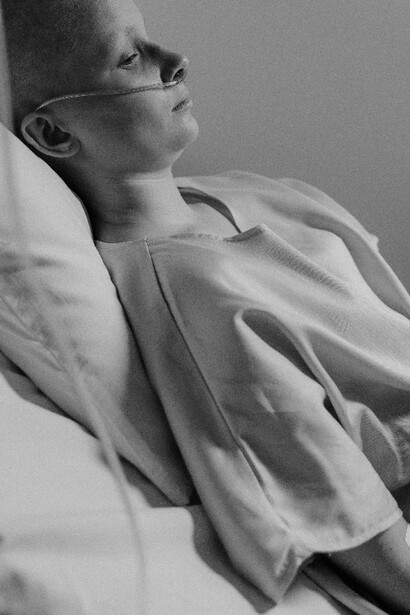A young pacient rests in hospital bed after treatment 