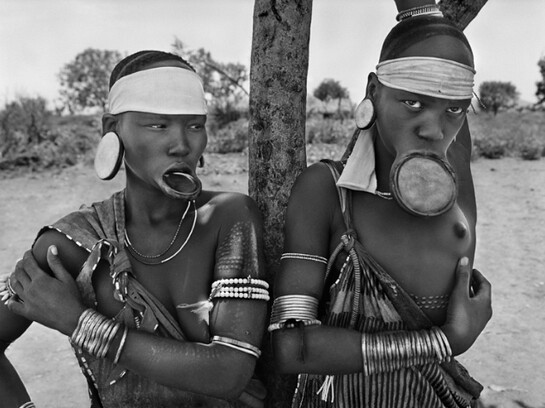 Sebastião Salgado, Mursi village of Dargui in Mago National Park, near Jinka, Ethiopia (two women with lip plates), 2007, Gelatin silver print, 50 x 60 cm/20 x 24 inches © Sebastião Salgado/Amazonas Images