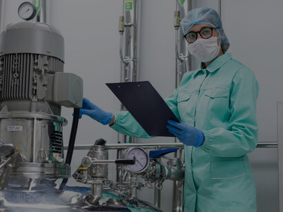 A scientist in a blue suit observes the manufacturing process, highlighting the critical stages of food production, processing, and distribution