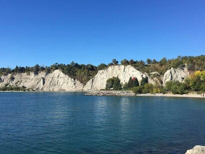 The majestic and still waters of Lake Ontario glistening along the coast of Scarborough Bluffs, Canada
