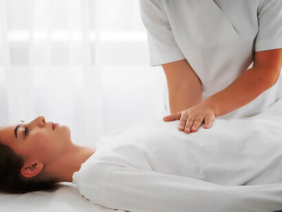 A woman undergoing somatic therapy for holistic well-being