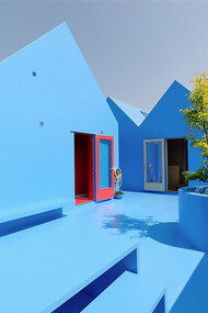 Didden Village in Rotterdam, Netherlands, uses vivid blue forms to create a symbolic rooftop landscape that blends architecture with imagination