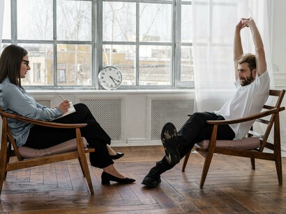 A person stretching in a therapy session. Self-regulation is important  