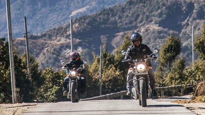 Pema Khandu minister riding a motorbike in the mountains of India