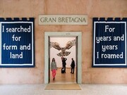 Jeremy Deller walks towards the entrance of the British Pavilion, where his installation English Magic is on show