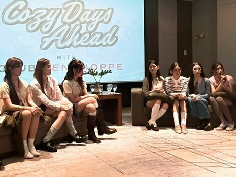 The group gathered in thoughtfully styled outfits, showing a pause for their simplicity to surface