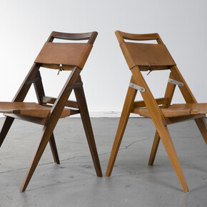 Folding chair with jacaranda frame and leather seat. Designed by Lina Bo Bardi for Studio de Arte Palma, Brazil, circa 1950. (seat height: 16.5") 17.75" L x 16.75" W x 32.25" H / 45.1cm L x 42.5cm W x 81.9cm H. Photo: Joe Kramm/R & Company.