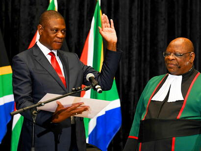Deputy President of South Africa Paul Mashatile takes the oath of office alongside Chief Justice Raymond Zondo on 3 July, 2024, at the Cape Town International Convention Centre, Cape Town, South Africa, marking a new chapter in South Africa's political landscape