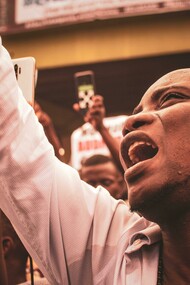 A black man in a crowd, protesting