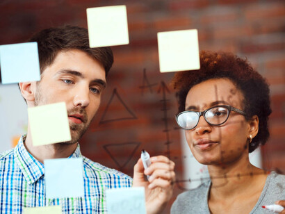 A focused discussion takes place as the individuals assess and categorise various approaches to overcoming their current challenge